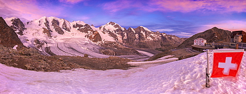 Sunrise at the Diavolezza Refuge with Swiss flag in foreground, Bernina Pass, Engadine, Graubunden, Switzerland, Europe