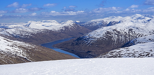 Looking down to Loch Lyon and Glen Lyon from the summit ridge of Beinn Dorain in the Scottish Highlands, Scotland, United Kingdom, Europe