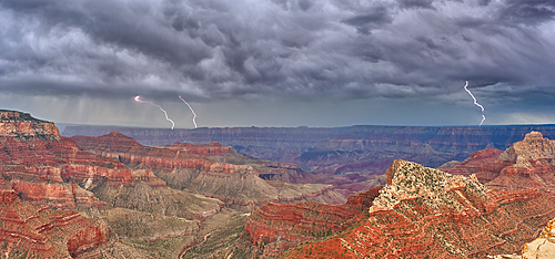 Panorama of a lightning storm passing over Grand Canyon Arizona, viewed from Cape Royal on the North Rim. Composed of 5 photos stitched together.