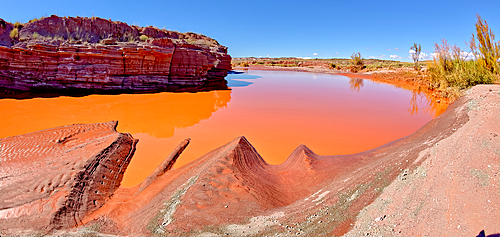 The red water of Lithodendron Wash, red from bentonite clay, in Petrified Forest National Park, Arizona, United States of America, North America