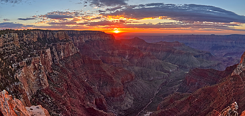 The sun rising at Grand Canyon North Rim, viewed from the Angels Window Overlook at Cape Royal, Grand Canyon National Park, UNESCO World Heritage Site, Arizona, United States of America, North America