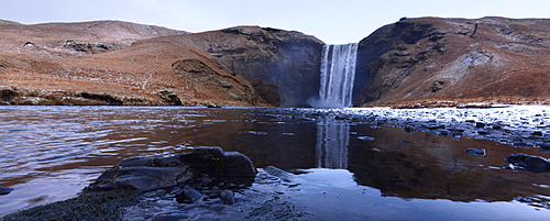 Skogafoss waterfall with reflection, Iceland, Polar Regions