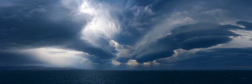 Panorama image of Lenticular clouds over the ocean, Nunavut and Northwest Territories, Canada, North America