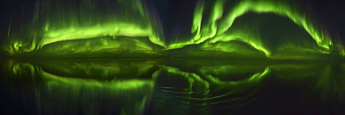 180 degree panorama of the Northen Lights (Aurora Borealis) over the ocean, Nunavut and Northwest Territories, Canada, North America