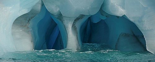 Panorama image of iceberg carved by wind and water