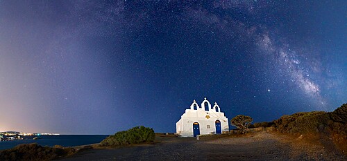 Milky Way arches above Agios Georgios on Paros Island, Cyclades, Greek Islands, Greece, Europe