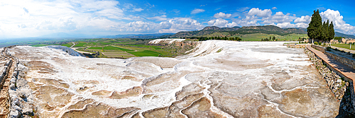 Pamukkale panorama with calcium carbonate white travertines and Hierapolis ancient city in Turkey