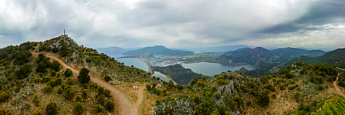 Drone panoramic view of camper vans on a viewpoint to Dalyan turtle bay on a cloudy day in Turkey