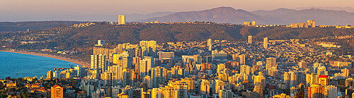 Elevated view of Vina del Mar coastal city at sunset seen from Mirador Pablo Neruda, Vina del Mar, Chile