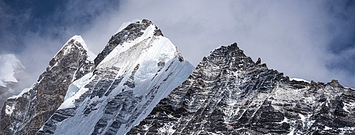 Panoramic View of Langtang Lirung and Its Rugged Neighbors Seen Across the Langtang Valley Under Dramatic Skies