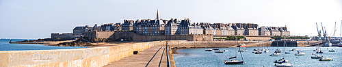 Wide panoramic view of Saint-Malo walled city and harbor seen from the pier Môle des Noires