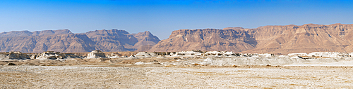 Panoramic view of Negev Desert with Orange sandstone mountains with a blue sky in Eilat, Israel