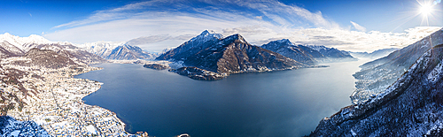 Aerial view of Monte Legnone and the snowy village of Dongo, Lake Como, Lombardy, Italy