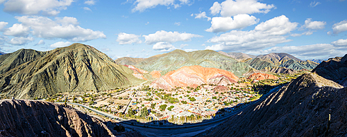Aerial view of the ancient village of Purmamarca perched in a valley surrounded by mountains, Argentina