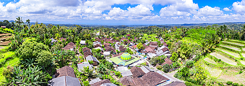Aerial panoramic of the rural village of Licin surrounded by terraced fields, Bali, Indonesia