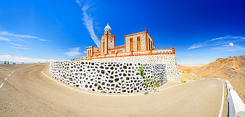Panoramic of the empty desert road leading to Entallada lighthouse, Tuineje, Fuerteventura, Canary Islands, Spain