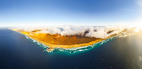 Aerial panoramic of golden sand of Cofete beach washed by the crystal sea, Jandia Natural Park, Fuerteventura, Canary Islands