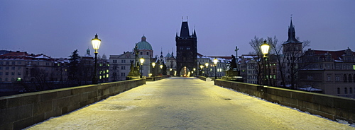 Charles Bridge in winter snow, Prague, UNESCO World Heritage Site, Czech Republic, Europe