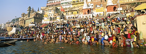 Hindus bathing in the early morning in the holy river Ganges (Ganga) along Dasswamedh Ghat, Varanasi (Benares), Uttar Pradesh state, India, Asia