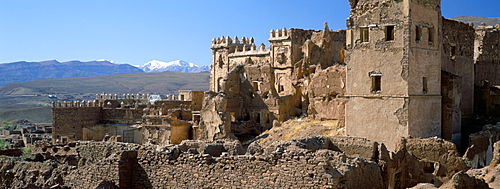 Ruins of Glaoui kasbah at Telouet, with snow capped High Atlas Mountains in distance, Telouet, Morocco, North Africa, Africa