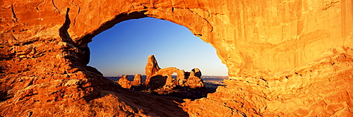 Turret Arch through North Window at sunrise, Arches National Park, Moab, Utah, United States of America (U.S.A.), North America