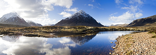 Panoramic view across River Etive towards snow-covered mountains including Buachaille Etive Mor, Rannoch Moor, near Fort William, Highland, Scotland, United Kingdom, Europe