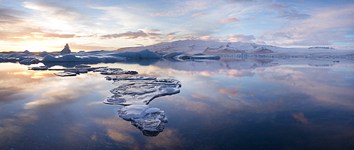 Panoramic view at sunset during winter over Jokulsarlon, a glacial lagoon at the head of the Breidamerkurjokull Glacier on the edge of the Vatnajokull National Park, South Iceland, Iceland, Polar Regions