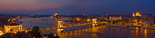 Panorama of the city at dusk with the Hungarian Parliament building and the Chain bridge (Szechenyi Lanchid) over the River Danube, UNESCO World Heritage Site, Budapest, Hungary, Europe