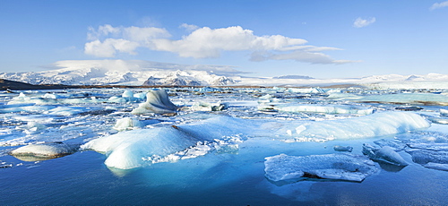 Panorama of mountains and icebergs locked in the frozen water, Jokulsarlon Iceberg Lagoon, Jokulsarlon, South East Iceland, Iceland, Polar Regions