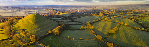 Aerial view by drone of Glastonbury Tor on a frosty morning on the Somerset Levels, Somerset, England, United Kingdom, Europe