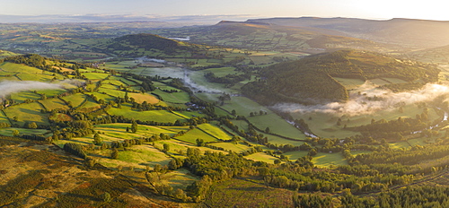 Aerial view by drone of mist floating over the Usk Valley at dawn, Brecon Beacons National Park, Powys, Wales, United Kingdom, Europe