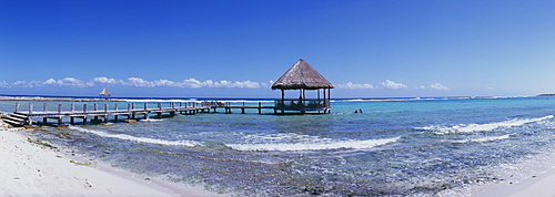 Pier with palapa jutting out into the water from the beach, Mayan Riviera, Akumal, Yucatan, Quintana Roo, Mexico, North America