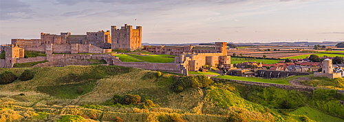 Aerial view by drone of Bamburgh Castle, Bamburgh, Northumberland, England, United Kingdom, Europe