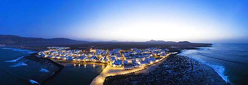 Caleta de Famara at dusk, drone shot, Lanzarote, Canary Islands, Spain, Europe