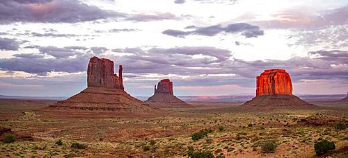 Red glowing rock formation at sunset, Table mountains West Mitten Butte, East Mitten Butte, Merrick Butte, Monument Valley, Navajo Tribal Park, Navajo Nation Reservation, Arizona, Utah, USA, North America