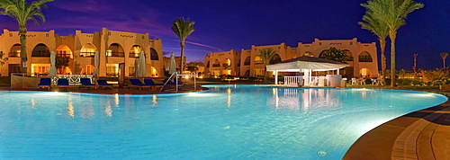 Swimming pool with palm trees at sunset, Hilton Nubian Resort, Al Qusair, Marsa Alam, Egypt, Africa