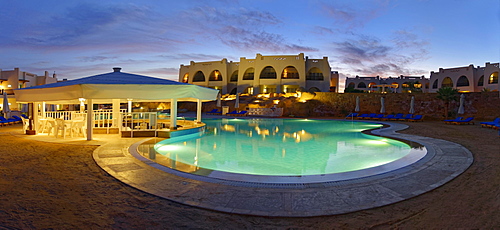 Swimming pool with palm trees at sunset, Hilton Nubian Resort, Al Qusair, Marsa Alam, Egypt, Africa