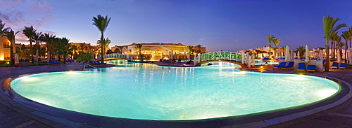 Swimming pool with palm trees at sunset, Hilton Nubian Resort, Al Qusair, Marsa Alam, Egypt, Africa