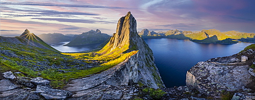 Sun rising over Bergen, morning atmosphere, steep mountain Segla, fjord Mefjorden with Bergen, island Senja, Troms, Norway, Europe