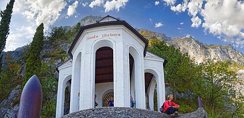 Chapel and viewpoint Santa Babara with hiker, Riva del Garda, Lake Garda North, Trento, Trentino-Alto Adige, Italy, Europe