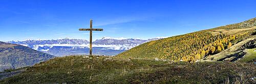 Mountain cross, view of the Lower Valais with autumn forest, Alpage de Mase, Louere, Valais, Switzerland, Europe