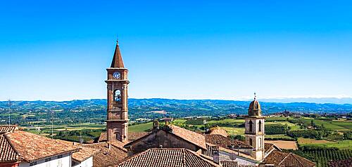 GOVONE, ITALY - CIRCA AUGUST 2020: Piedmont hills in Italy, Monferrato area. Scenic countryside during summer season with vineyard field. Wonderful blue sky in background