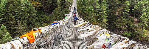 Suspention bridge on the Everest Base Camp Trek, Himalaya mountains, Sagarmatha National Park, Nepal. Web banner in panoramic view