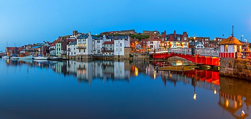 View of Whitby Bridge and reflections on River Esk at dusk, Whitby, Yorkshire, England, United Kingdom, Europe