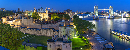 View of the Tower of London, UNESCO World Heritage Site, and Tower Bridge from Cheval Three Quays at dusk, London, England, United Kingdom, Europe