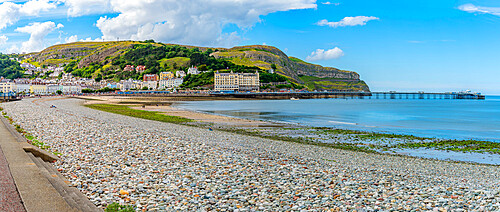 View of Llandudno Pier and the Great Orme in background from promenade, Llandudno, Conwy County, North Wales, United Kingdom, Europe