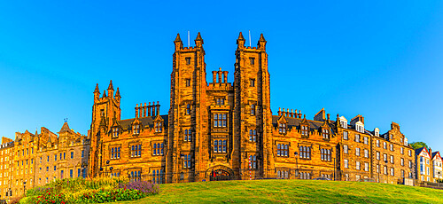 View of New College, The University of Edinburgh, on The Mound, from Princes Street at sunset, Edinburgh, Scotland, United Kingdom, Europe