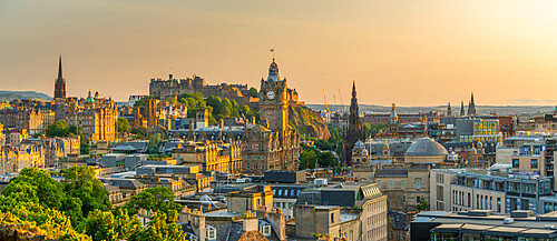 View of Edinburgh Castle, Balmoral Hotel and city skyline from Calton Hill at golden hour, Edinburgh, Lothian, Scotland, United Kingdom, Europe