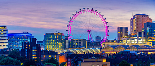 View of the London Eye and rooftop of Waterloo Station at dusk, Waterloo, London, England, United Kingdom, Europe