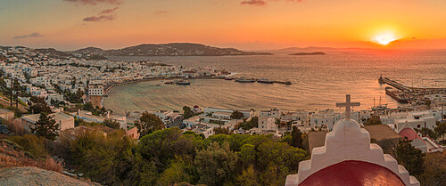 View of chapel and town from elevated view point at sunset, Mykonos Town, Mykonos, Cyclades Islands, Greek Islands, Aegean Sea, Greece, Europe